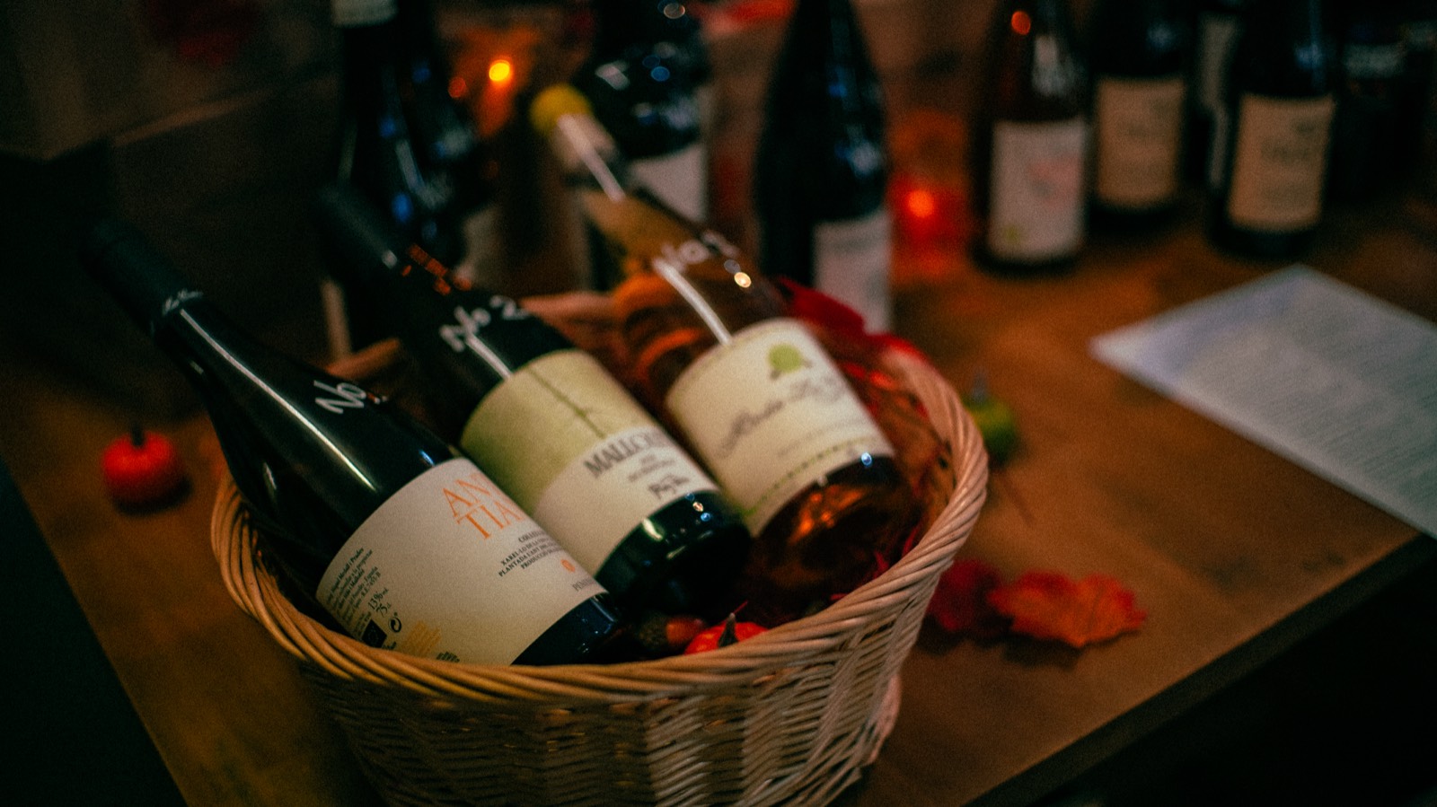 A gift basket of wine bottles on the shop counter
